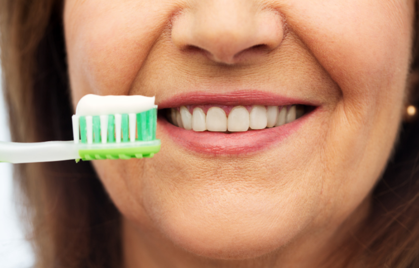 Woman brushing her teeth