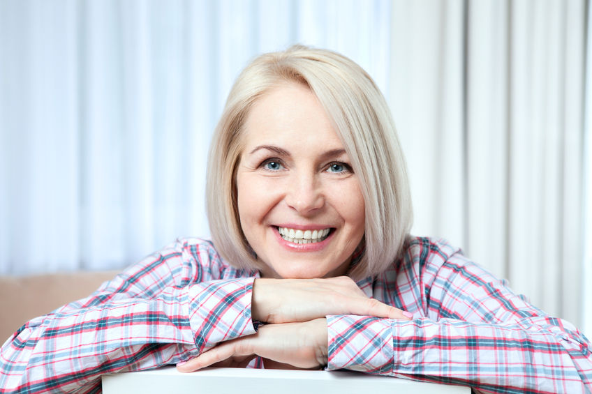 lady smiling from successful dental implant recovery